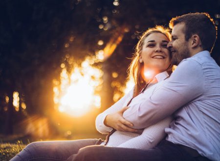 Happy couple laughing together — how to keep the spark alive in a relationship