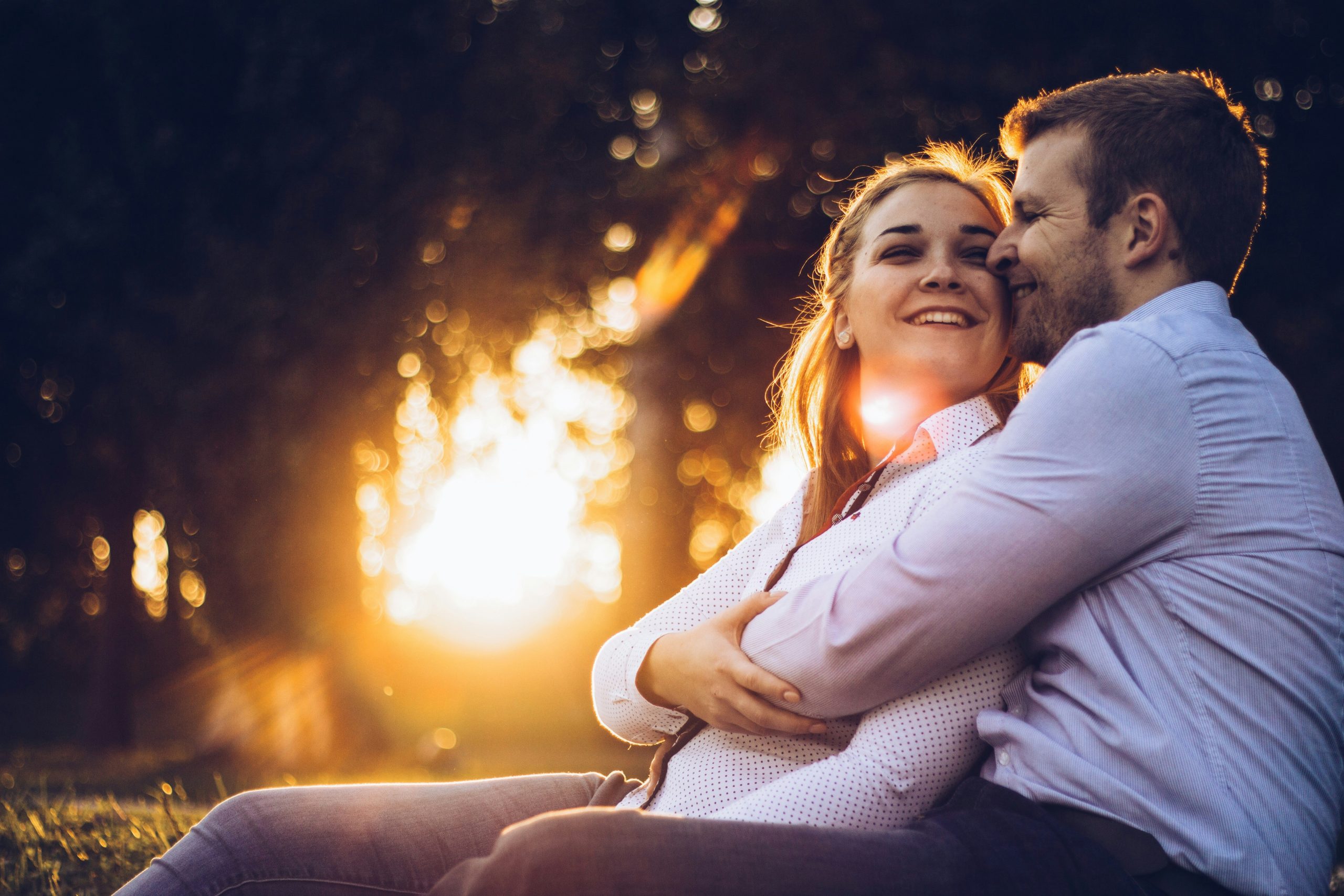 Happy couple laughing together — how to keep the spark alive in a relationship