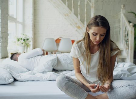 Person sitting alone feeling disconnected — signs of emotional unavailability in a partner