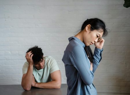 Person looking at phone anxiously — how to deal with jealousy in a relationship