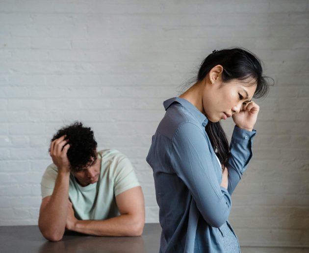 Person looking at phone anxiously — how to deal with jealousy in a relationship