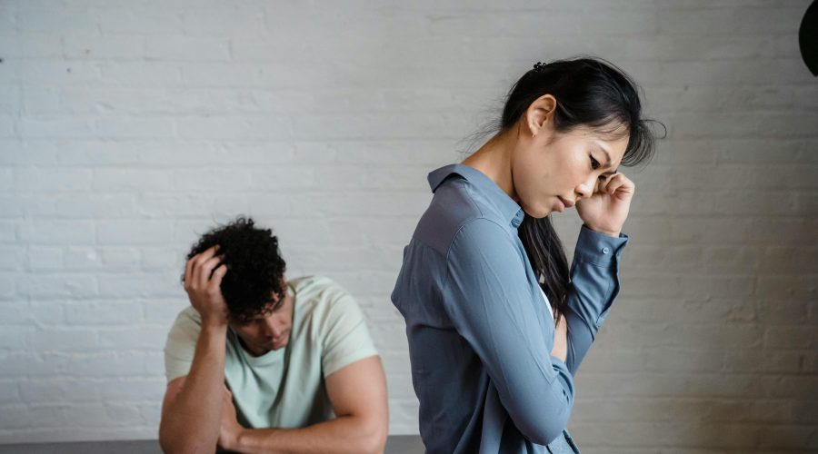 Person looking at phone anxiously — how to deal with jealousy in a relationship